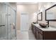 Spa bathroom with dual vanity, glass shower, and modern finishes at 144 Arabella Ct, Cary, NC 27518