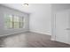 Sun-filled bedroom with neutral walls and hardwood floors at 144 Arabella Ct, Cary, NC 27518