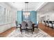 Bright dining area with ample natural light, an elegant chandelier, and comfortable seating at 144 Arabella Ct, Cary, NC 27518