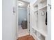 Hallway with built in shelving and a view into the laundry room at 144 Arabella Ct, Cary, NC 27518
