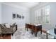 Serene home office with natural light, wood floors, crown molding, and neutral decor at 144 Arabella Ct, Cary, NC 27518