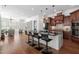 Open kitchen design with island seating flows into living areas at 144 Arabella Ct, Cary, NC 27518