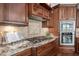 Gourmet kitchen features stainless steel appliances and custom cabinetry at 144 Arabella Ct, Cary, NC 27518