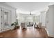 Bright living room featuring neutral colors, plantation shutters, and hardwood flooring at 144 Arabella Ct, Cary, NC 27518