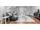 Comfortable living room boasting a sectional, stylish decor, and built-in shelves, perfect for relaxing at 144 Arabella Ct, Cary, NC 27518