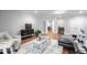 Inviting living room features hardwood floors, stylish furniture, and an open layout connecting to other rooms at 144 Arabella Ct, Cary, NC 27518