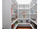 Spacious walk-in pantry with custom shelving and ample storage space at 144 Arabella Ct, Cary, NC 27518