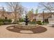 Picturesque water fountain surrounded by manicured landscaping, enhances the community's charm at 144 Arabella Ct, Cary, NC 27518