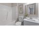 Well-lit bathroom with shower-tub combo and vanity at 1620 Briarmont Ct, Raleigh, NC 27610