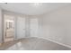 Neutral bedroom featuring plush carpet, two closets, and access to a bathroom with modern fixtures at 1620 Briarmont Ct, Raleigh, NC 27610