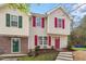Charming two-story home with red shutters, a red front door, and well-maintained landscaping at 1620 Briarmont Ct, Raleigh, NC 27610