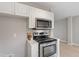 Modern kitchen featuring stainless steel oven and microwave at 1620 Briarmont Ct, Raleigh, NC 27610