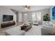 Bright living room features modern decor and hardwood floors at 1620 Briarmont Ct, Raleigh, NC 27610