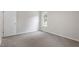Cozy bedroom featuring neutral carpet and paint and a window offering natural light at 206 Woods Run, Knightdale, NC 27545