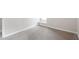 Angle view of the bedroom with neutral carpeting, white trim and baseboards, and neutral paint at 206 Woods Run, Knightdale, NC 27545