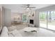 Cozy living room with fireplace, modern furniture, and an adjacent dining area at 206 Woods Run, Knightdale, NC 27545