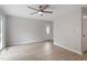 Inviting living room featuring light wood floors, neutral paint, and a bright front door at 206 Woods Run, Knightdale, NC 27545