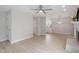 Open-concept living room featuring light wood floors, neutral paint, and a view to the kitchen at 206 Woods Run, Knightdale, NC 27545
