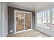 The screened-in porch offers natural light and a view of the kitchen through sliding glass doors at 206 Woods Run, Knightdale, NC 27545