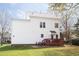 The home's back exterior features a deck and patio area, perfect for outdoor living at 2061 Carriage Way, Chapel Hill, NC 27517