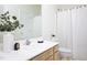 Well-lit bathroom features a vanity, sink, mirror, and shower at 2061 Carriage Way, Chapel Hill, NC 27517