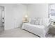 Bright bedroom features a daybed, doorway, and neutral carpet at 2061 Carriage Way, Chapel Hill, NC 27517