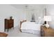 Cozy bedroom featuring neutral decor, a ceiling fan, and a large window for natural light at 2061 Carriage Way, Chapel Hill, NC 27517