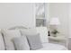 Bright bedroom features a window and comfortable daybed with pillows at 2061 Carriage Way, Chapel Hill, NC 27517