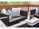Cozy deck seating area with comfortable cushions and pillows, ideal for relaxation at 2061 Carriage Way, Chapel Hill, NC 27517