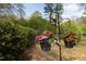 Hanging flower baskets in a beautiful yard setting at 2061 Carriage Way, Chapel Hill, NC 27517