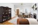 Open-concept living room with hardwood floors, fireplace, access to the staircase and bright entryway at 2061 Carriage Way, Chapel Hill, NC 27517