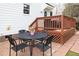 Outdoor patio with metal table and chairs, great for enjoying outdoor meals at 2061 Carriage Way, Chapel Hill, NC 27517