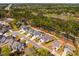 Aerial view of a neighborhood with lush green trees and landscaping at 2075 Toad Hollow Trl, Apex, NC 27502