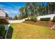 Well-manicured backyard with lawn, privacy fence, and wooded area at 2075 Toad Hollow Trl, Apex, NC 27502