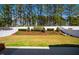 Private backyard with green lawn, garden area, and white privacy fence at 2075 Toad Hollow Trl, Apex, NC 27502