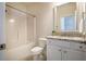 Well-lit bathroom with granite vanity, modern fixtures, and shower-tub combination at 2075 Toad Hollow Trl, Apex, NC 27502