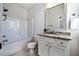 Bright bathroom with a tub and shower combo, granite countertop, and tile floor at 2075 Toad Hollow Trl, Apex, NC 27502