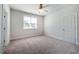 Bedroom featuring neutral carpet, a window with blinds, and white trim at 2075 Toad Hollow Trl, Apex, NC 27502