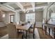 Beautiful dining room with a coffered ceiling, chandelier, and room for six people at 2075 Toad Hollow Trl, Apex, NC 27502