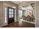 Elegant dining room featuring a coffered ceiling, chandelier, and stylish decor at 2075 Toad Hollow Trl, Apex, NC 27502