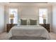 Comfortable main bedroom featuring a king-size bed, two nightstands, and neutral decor at 2075 Toad Hollow Trl, Apex, NC 27502