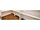 View of a bright pantry with shelving and wood floor at 2075 Toad Hollow Trl, Apex, NC 27502