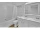 Well-lit bathroom with a double sink vanity, tub and shower at 208 Chandler Chase Ct, Morrisville, NC 27560