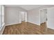 Spacious bedroom featuring wood-look floors, a vaulted ceiling, and ensuite bathroom access at 208 Chandler Chase Ct, Morrisville, NC 27560