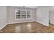 Neutral bedroom with laminate flooring, a well-lit bathroom, and bright windows at 208 Chandler Chase Ct, Morrisville, NC 27560