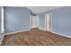 Bedroom featuring neutral paint, wood floors, and a view to other areas at 208 Chandler Chase Ct, Morrisville, NC 27560