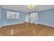 Large living room showcasing beautiful hardwood floors and open floor plan at 208 Chandler Chase Ct, Morrisville, NC 27560