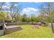 Large fenced backyard with mature trees and patio perfect for entertaining at 208 S Guthrie Ave, Durham, NC 27703
