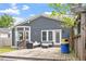 Rear exterior view of home showing siding, patio and access to the yard at 208 S Guthrie Ave, Durham, NC 27703