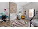 Unique bedroom features an exposed brick fireplace and bright pops of color at 208 S Guthrie Ave, Durham, NC 27703